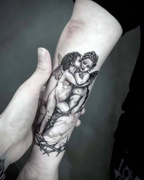 Womens Hands Kissing Angels Tattoo