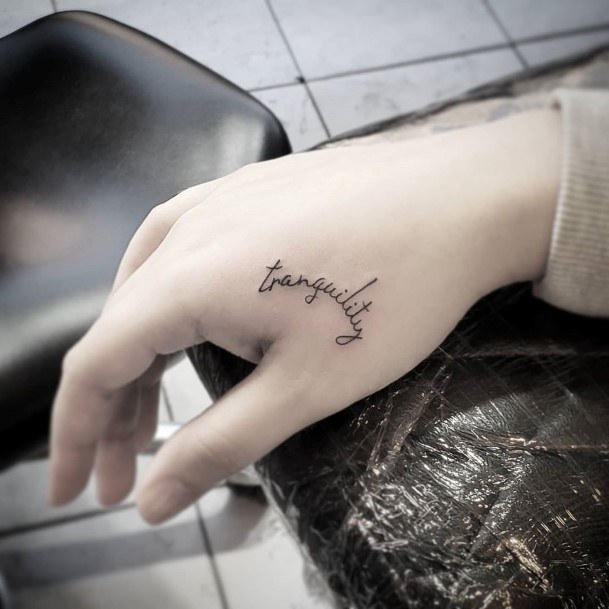 Womens Hands Small Cursive Lettering Tattoo