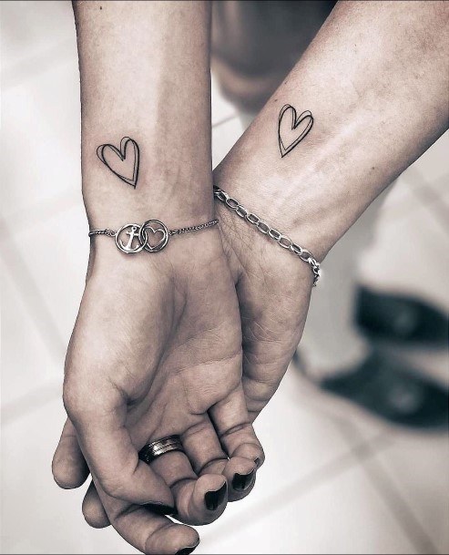 Womens Interlocked Heart On Wrist Matching Tattoo