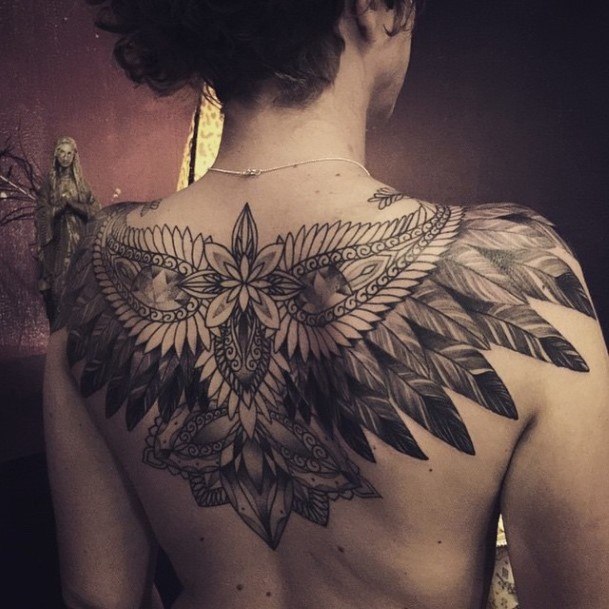 Womens Large Feathered Tattoo On Back