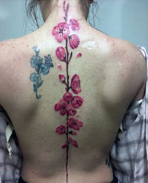 Womens Pink Delicate Flowers Blue Spine Tattoo
