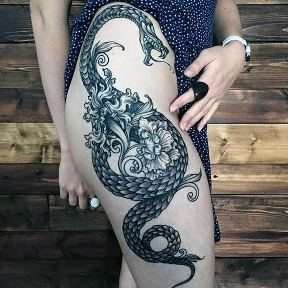 Womens Raging Snake And Smoky Tattoo On Legs