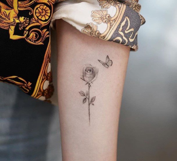 Womens Small Rose And Butterfly Tattoo On Arms