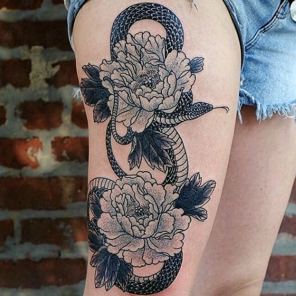 Womens Snake And Flower Tattoo On Leg
