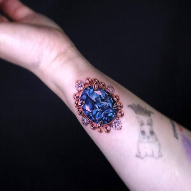 Womens Tattoo Ideas With Gem Design Wrist Blue Stone