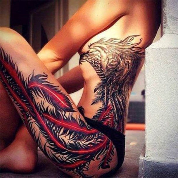 Womens Thighs Cool Red Tinged Feather Tattoo