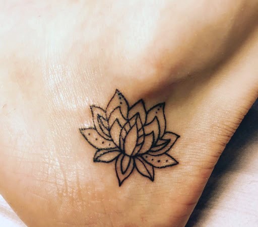 Womens Tiny Black Lotus Tattoo On Feet
