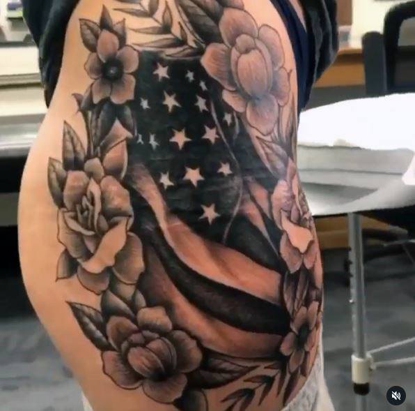 Womens Torso Flowers And American Flag Tattoo