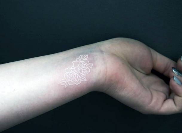 Womens Wrist Small White Ink Tattoo