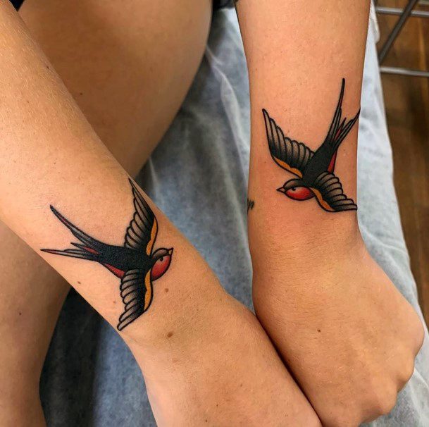 Womens Wrists Flying Bird Traditional Tattoo