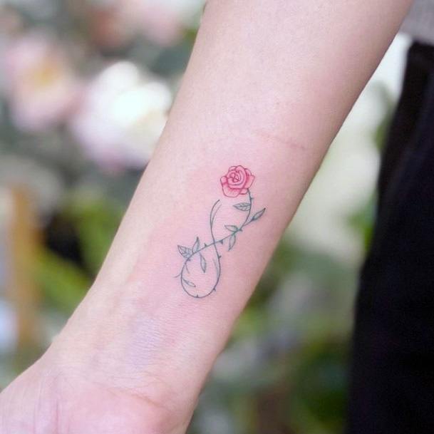 Womens Wrists Pink Rose And Leafy Stalk Infinity Tattoo