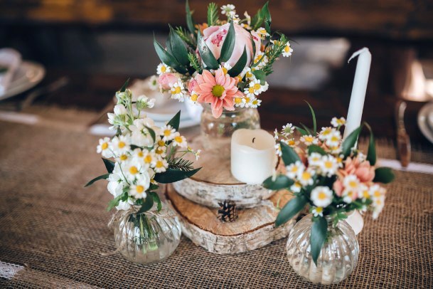 Decorations Made Of Wood And Wildflowers Served On The Festive Table