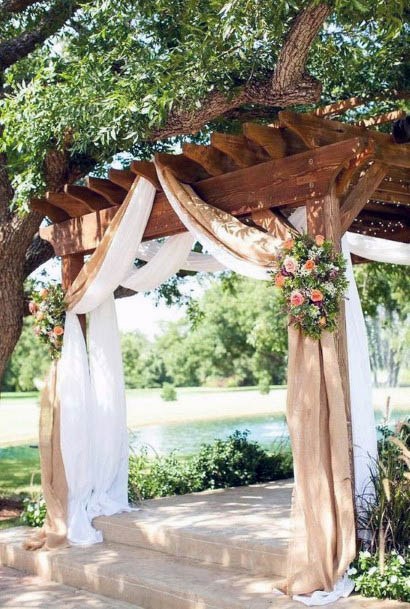 Wooden Beams And Burlap Curtains Wedding Decor