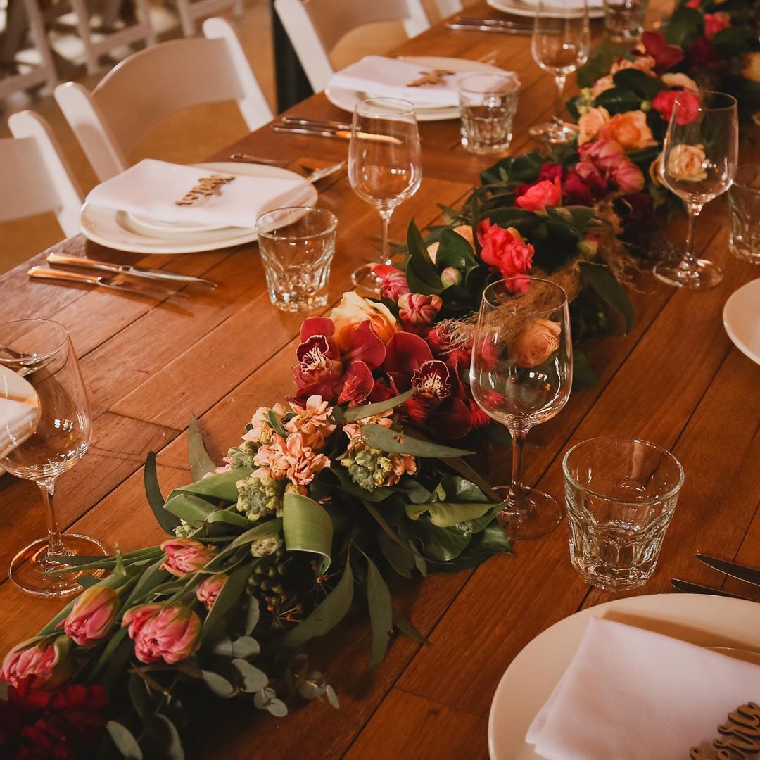 Wooden Dining Table And September Wedding Flowers Runner