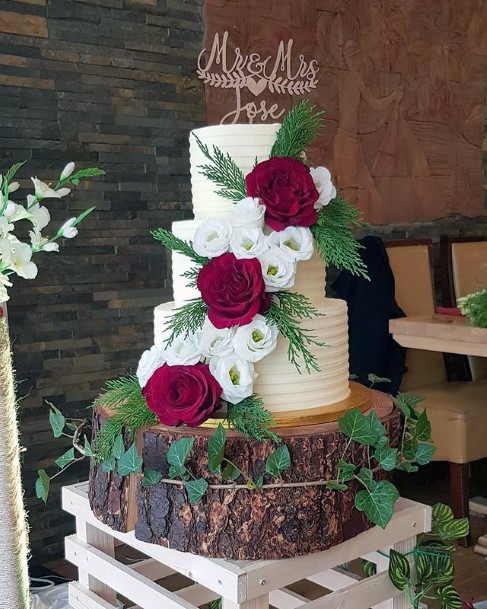 Wooden Log Base And Three Roses On Rustic Wedding Cake