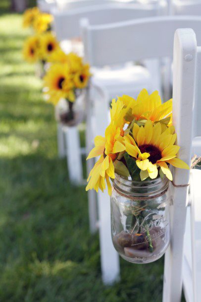 Yellow Bright Blooms On Mason Jar Wedding Decor