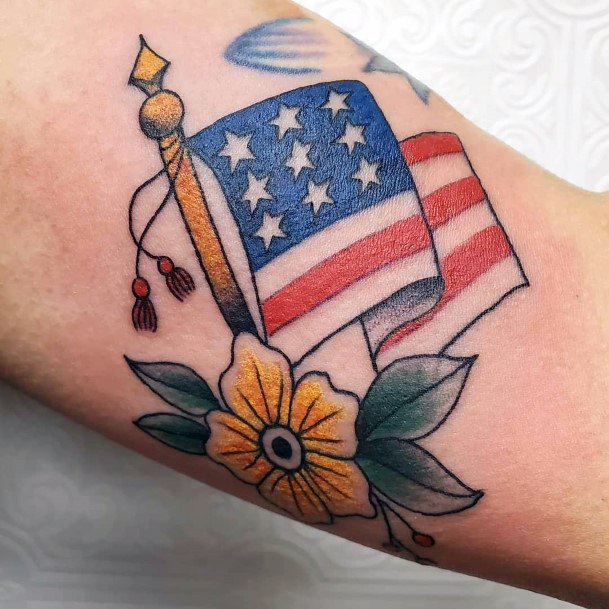 Yellow Flower And American Flag Tattoo For Women