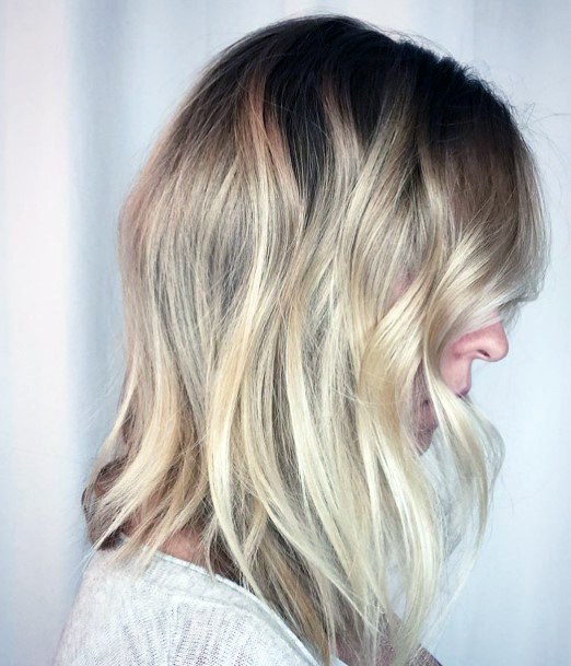 Young Blonde Woman With Daring Layered Mid Length Hair Inspiration