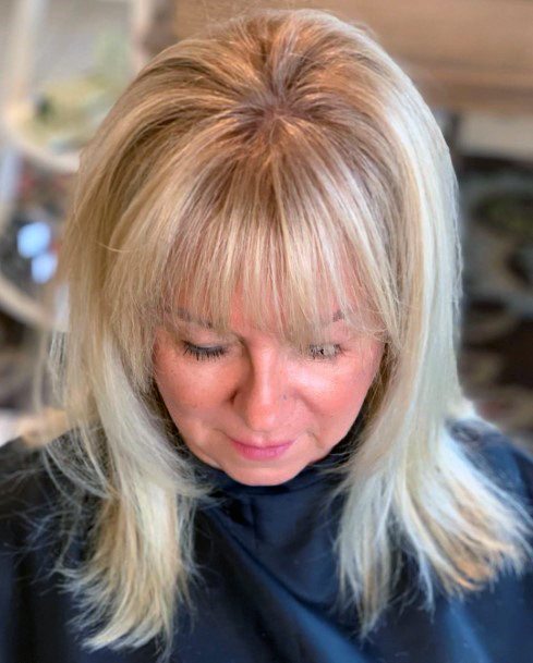 Youthful Hairstyles Over 50 Face Framing Bangs
